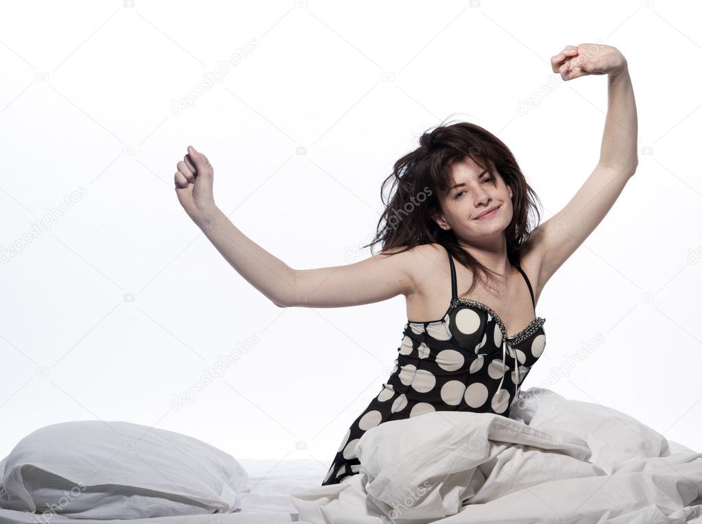Woman in bed awakening