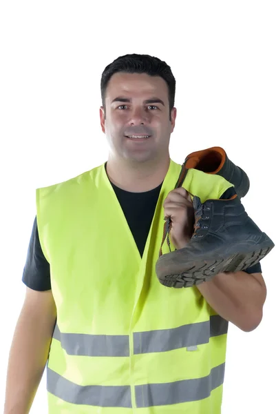 Attraktiver Mann in Arbeitskleidung und Schuhen lizenzfreie Stockbilder