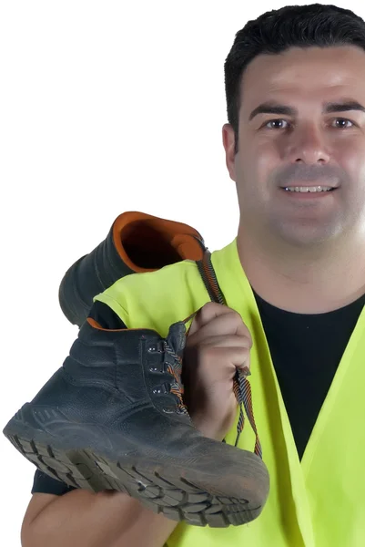Attraktiver Mann in Arbeitskleidung und Schuhen Stockbild