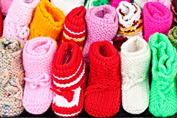 Stock image A lot of handmaded baby shoes