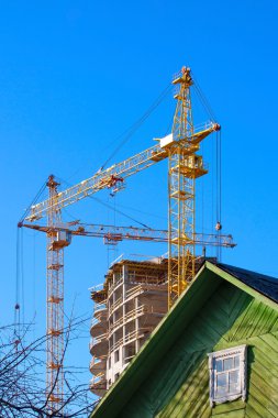 Two tower cranes building clipart