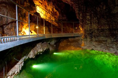 The underground lake in cave. clipart