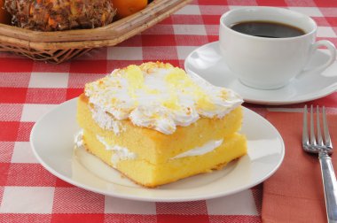 Lemon cake with coffee on a picnic table clipart