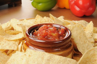 Snack tray with salsa and tortilla chips clipart