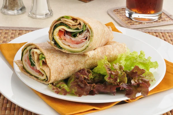 Turkey wraps on a bed of lettuce — Stock Photo, Image