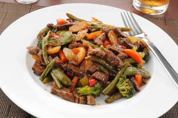 Beef stir fry on rice Stock Photo