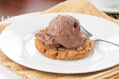 Ice cream on a chocolate chip cookie clipart