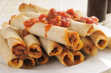 Taquitos with salsa clipart