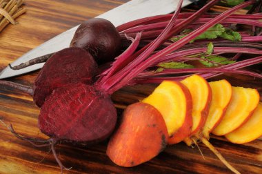 Sliced red and golden beets clipart