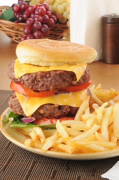 Super sized hamburger with fries — Stock Photo, Image