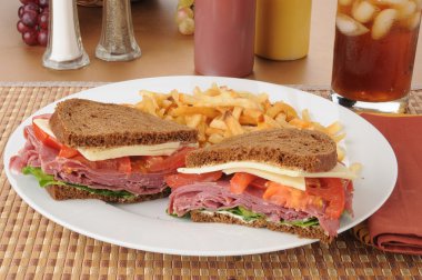 Corned beef sandwich with fries clipart