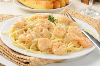 Shrimp scampi with garlic butter sauce clipart