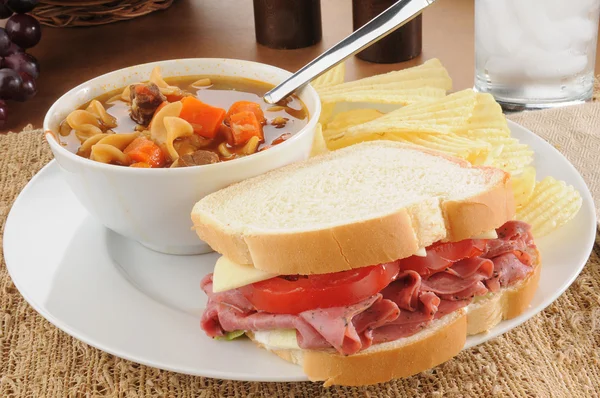 Pastrami sandwich with vegetable beef soup — Stock Photo, Image