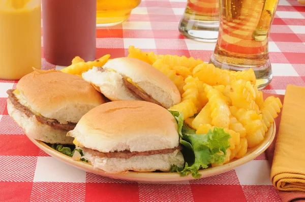 Sliders and beer with fries — Stock Photo, Image