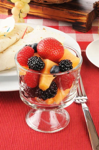 Fruit and berries with breakfast burritos — Stock Photo, Image