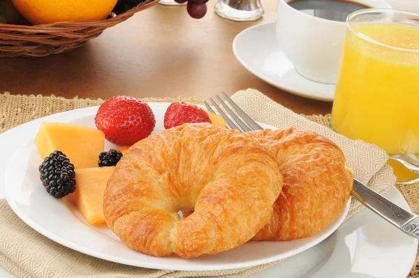Fruit and croissants — Stock Photo, Image