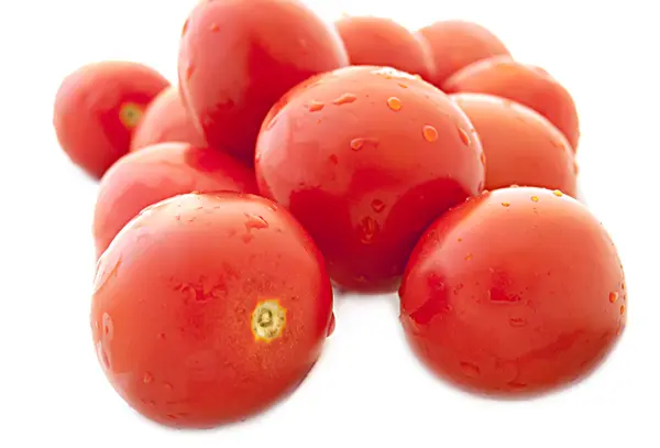 Wet cherry tomatoes on a white background — Stock Photo, Image