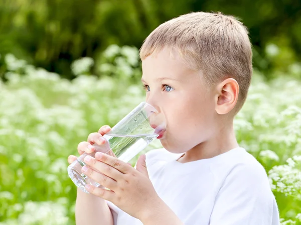 Child drinking pure water Stock Photo by ©maxoidos 9484875