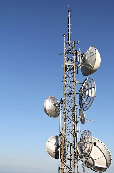 Telecommunication tower with parabolic receiver — Stock Photo, Image