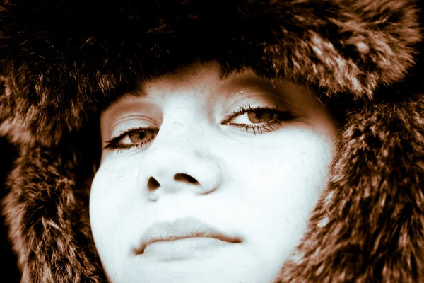 Upstage girl in a brown fur hat — Stock Photo, Image