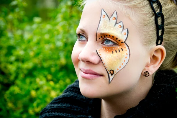 Young woman with face painting — Stock Photo, Image