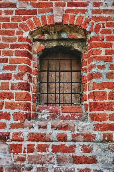 Window lattice to brick wall — Stock fotografie