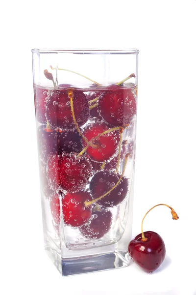 stock image Sweet cherry in glass with water