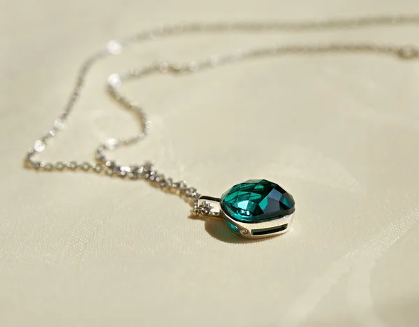 Pendant with a stone on a chain. — Stock Photo, Image
