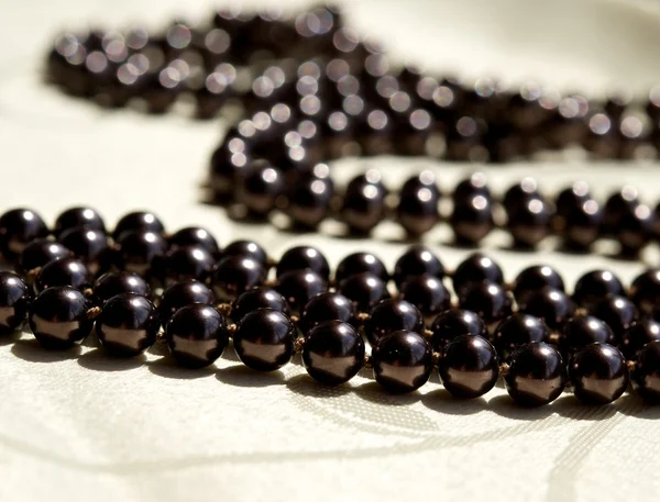 The thread of black pearls — Stock Photo, Image