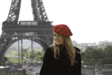 Female model in red hat Eiffel tower background clipart