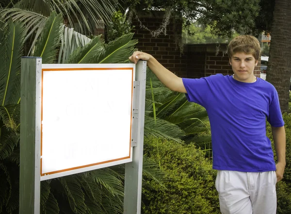 Teen male and blank sign — Stock Photo, Image