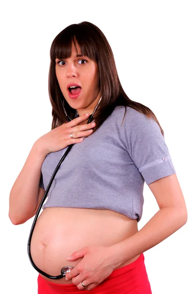 Zwangere vrouw met stethoscoop — Stockfoto
