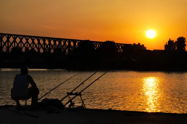 Západ slunce rybolov — Stock fotografie