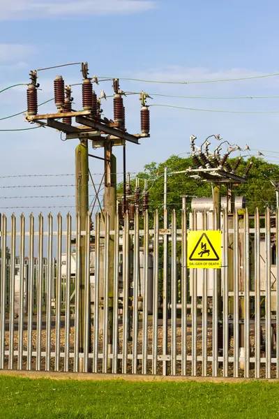 stock image A view of an electricity grid blue sky