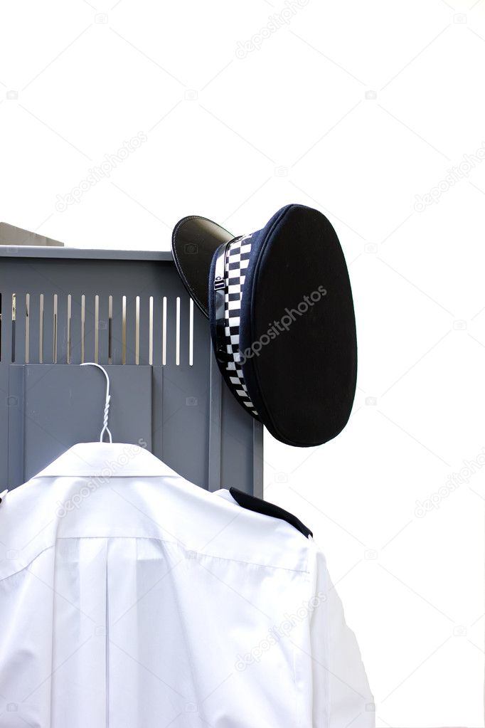 Policemans hat and shirt hanging on a locker door