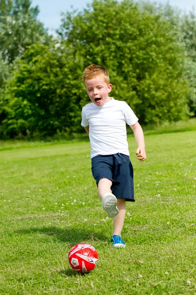 stock image Kicking a ball