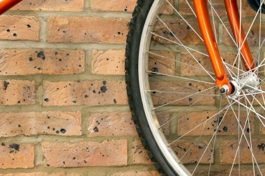 Bike hanging on the rack in the garage clipart