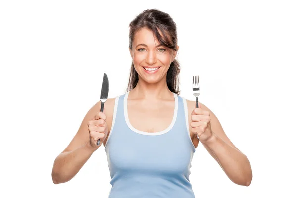Femme avec fourchette et couteau — Photo