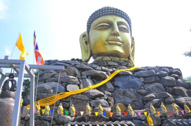 Buddha face in wowoojongsa temple, korea clipart