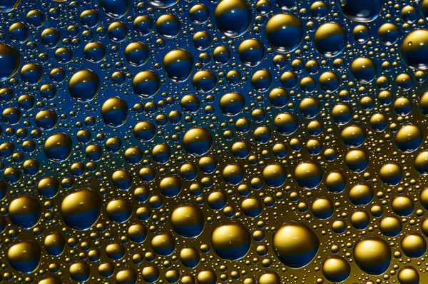 stock image Blue ang gold drops