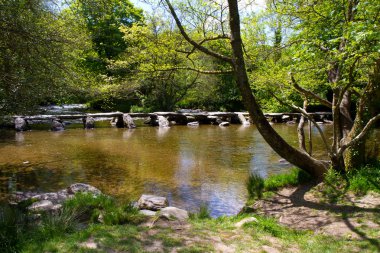 The historic Tarr Steps near Dulverton in Devon clipart