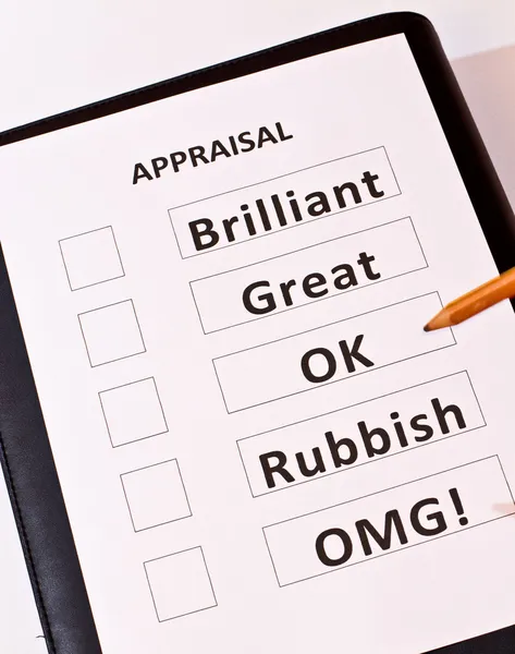 A fun perfomance appraisal form on black case — Stock Photo, Image