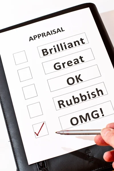 A fun perfomance appraisal form on black case — Stock Photo, Image