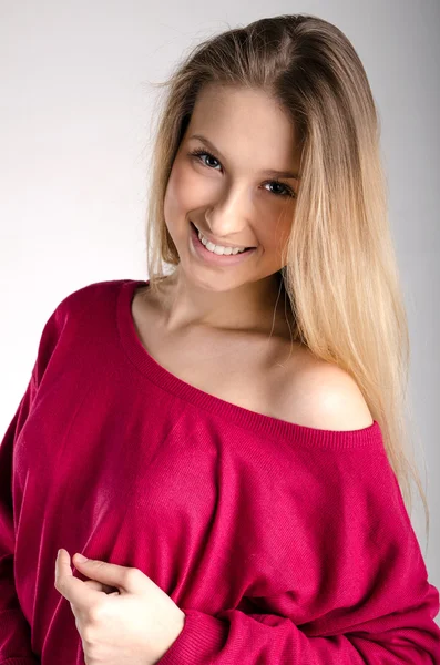Smilling attractive girl in red pullover — Stock Photo, Image
