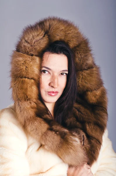 Brunette in fur coat — Stock Photo, Image