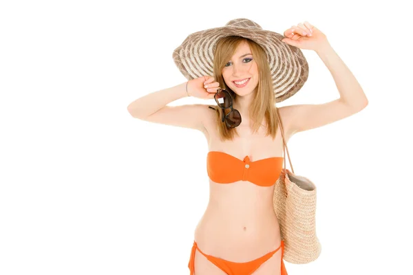 Jonge vrouw in oranje bikini — Stockfoto
