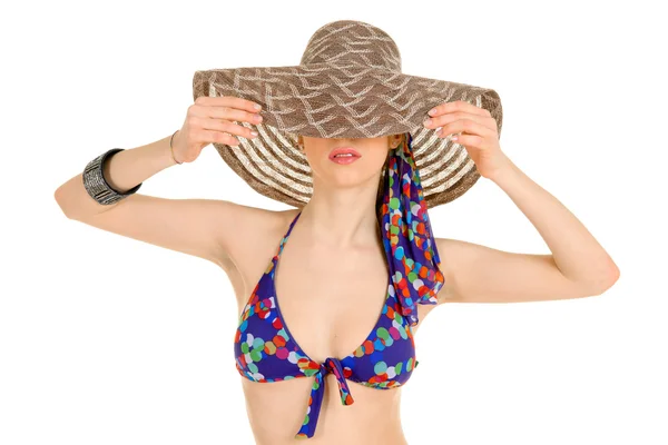 Kvinna i bikini med hatt Stockbild