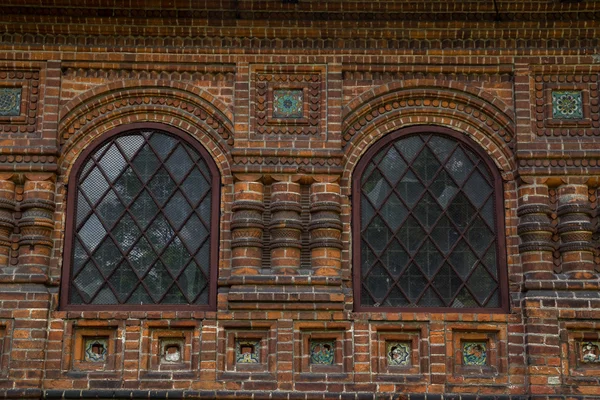 Large windows in red brick church — Stock Photo, Image