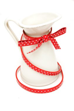 White jar with red belt on white background