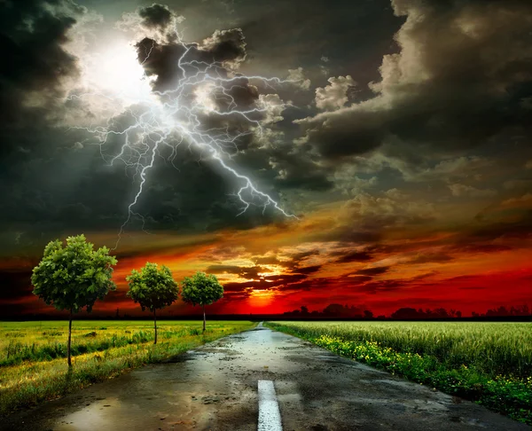 Asphalt road and lightning — Stock Photo, Image
